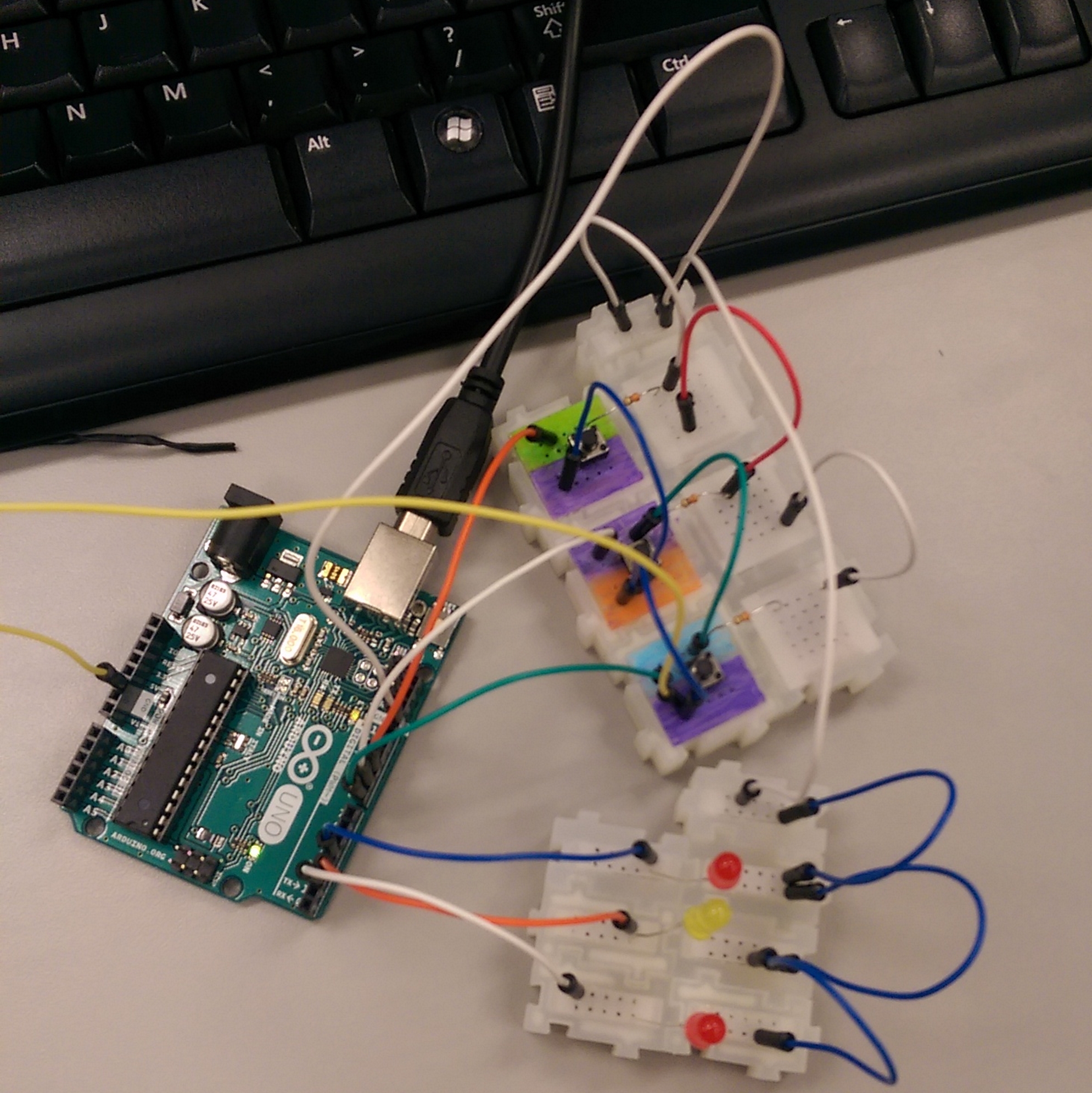 picture of an circuit organized with a section for LEDs and a section for buttons